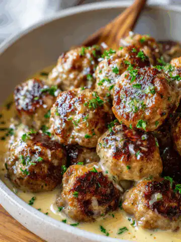 Easy Garlic Butter Meatballs served over creamy