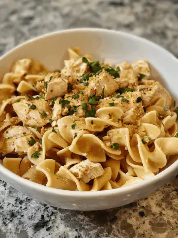 Chicken Buttered Noodles taken with iphone 15 pro max --iw 2 --ar 4:5 --v 6.0 --raw
