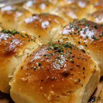 Garlic Butter Bread Rolls taken with iphone 15 pro max --iw 2 --ar 4:5 --v 6.0 --raw
