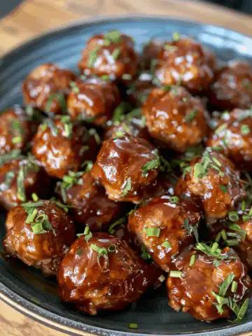 Honey BBQ Meatballs taken with iphone 15 pro max --iw 2 --ar 4:5 --v 6.0 --raw