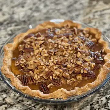 Pecan Pie Cobbler taken with iphone 15 pro max --iw 2 --ar 4:5 --v 6.0 --raw
