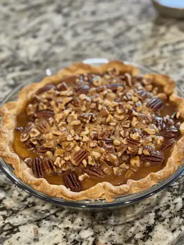 Pecan Pie Cobbler taken with iphone 15 pro max --iw 2 --ar 4:5 --v 6.0 --raw