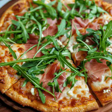 Pumpkin Pizza Crust with Arugula and Prosciutto taken with iphone 15 pro max --iw 2 --ar 4:5 --v 6.0 --raw