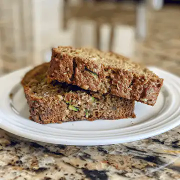 Vegan Zucchini Bread taken with iphone 15 pro max --iw 2 --ar 4:5 --v 6.0 --raw