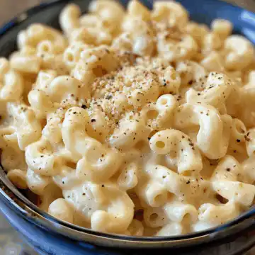 Irresistibly Creamy Stovetop Macaroni and Cheese taken with iphone 15 pro max --iw 2 --ar 4:5 --v 6.0 --raw