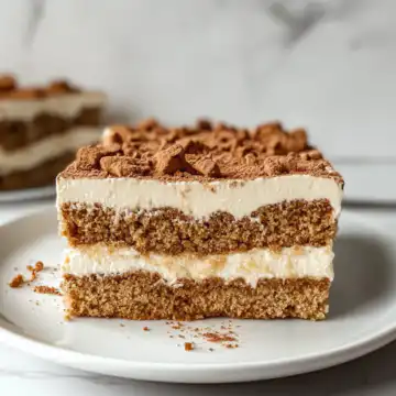 Biscoff Fridge Cake Recipe taken with iphone 15 pro max --iw 2 --ar 4:5 --v 6.1 --raw