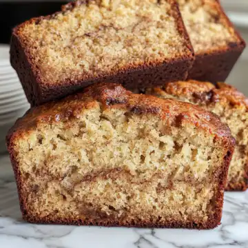Cinnamon Swirl Banana Bread Recipe taken with iphone 15 pro max --iw 2 --ar 4:5 --v 6.1 --raw