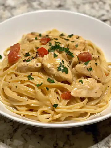 Creamy One Pot Cajun Chicken Linguine Recipe taken with iphone 15 pro max --iw 2 --ar 4:5 --v 6.1 --raw