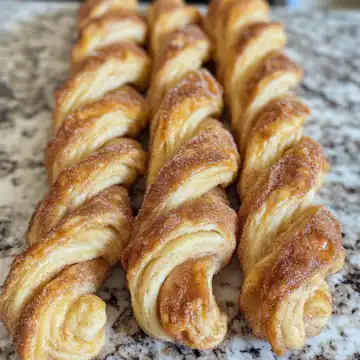Flaky Cinnamon Twists Recipe taken with iphone 15 pro max --iw 2 --ar 4:5 --v 6.1 --raw