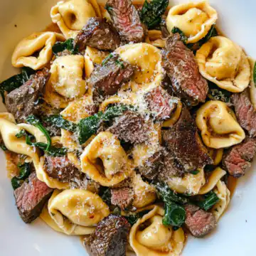 Garlic Steak Tortellini Recipe taken with iphone 15 pro max --iw 2 --ar 4:5 --v 6.1 --raw