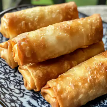 Homemade Cherry Cheesecake Egg Rolls Recipe taken with iphone 15 pro max --iw 2 --ar 4:5 --v 6.1 --raw