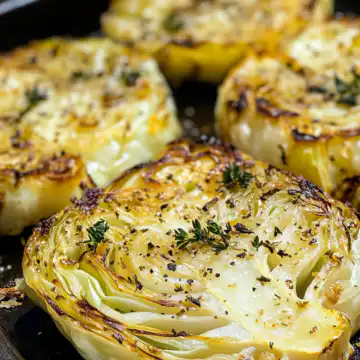Oven Roasted Garlic Cabbage Steaks Recipe taken with iphone 15 pro max --iw 2 --ar 4:5 --v 6.1 --raw