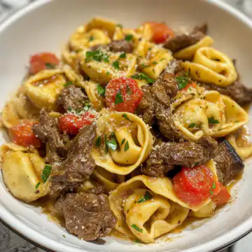 Philly Cheesesteak Tortellini Pasta Recipe taken with iphone 15 pro max --iw 2 --ar 4:5 --v 6.1 --raw