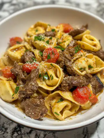 Philly Cheesesteak Tortellini Pasta Recipe taken with iphone 15 pro max --iw 2 --ar 4:5 --v 6.1 --raw