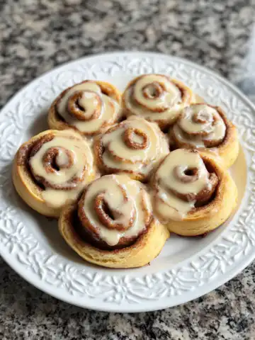 Red Velvet Cinnamon Rolls Recipe taken with iphone 15 pro max --iw 2 --ar 4:5 --v 6.1 --raw