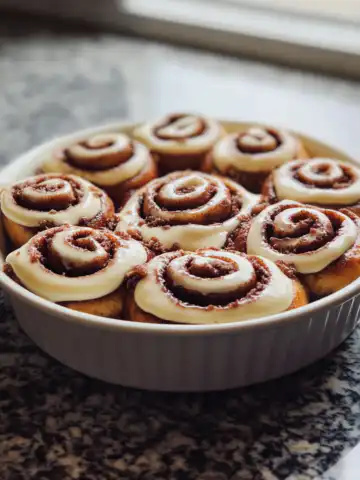 Red Velvet Cinnamon Rolls Recipe taken with iphone 15 pro max --iw 2 --ar 4:5 --v 6.1 --raw