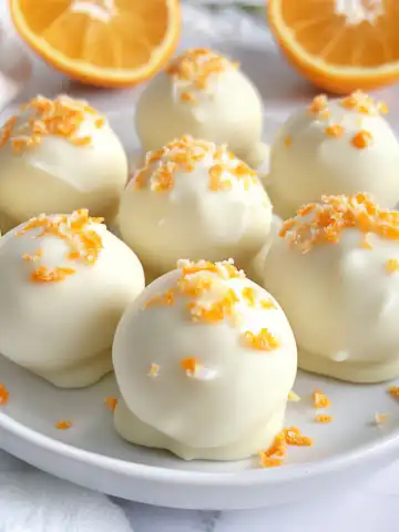 White Chocolate Orange Creamsicle Truffles Recipe taken with iphone 15 pro max --iw 2 --ar 4:5 --v 6.1 --raw
